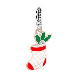 Detail of rose gold Christmas stocking pendant with red green enamel and crystal inlay