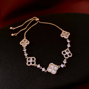 Exquisite gold clover bracelet with white shell inlays and micro-pave zircons