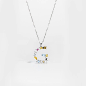 Detailed close-up of S925 silver letter G pendant necklace with colorful cubic zirconia