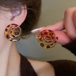 Vintage resin snail spiral stud earrings with brown leopard print pattern for women