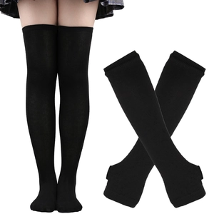 Detail view of black thigh-high socks showing over-the-knee fit and elastic cotton fabric