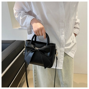 Fashionable black square handbag with large bow decoration and detachable shoulder strap