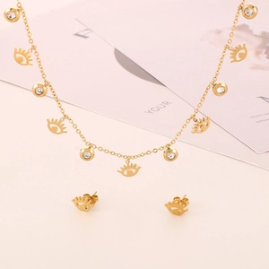 Detailed view of a gold Evil Eye jewelry set featuring rhinestone necklace and matching studs