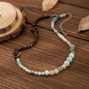 Men's hip hop tiger eye beaded necklace with turquoise and white stones on wood