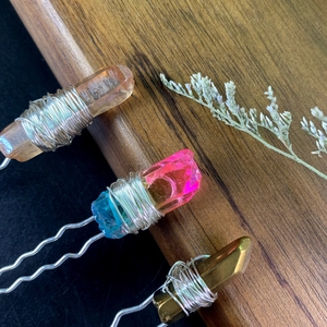 Detail of handcrafted U-shaped hair pins with natural crystal pillars and silver wire wrap