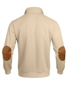Detail of men waffle knit pullover featuring brown leather elbow patches and ribbed cuffs