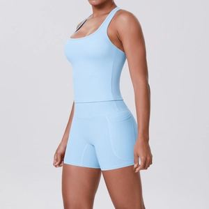 Side view of light blue fitness set with racerback tank top and shorts with pockets