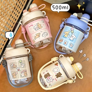 Flat lay of 500ml portable plastic cups with cartoon sleeves and matching straps