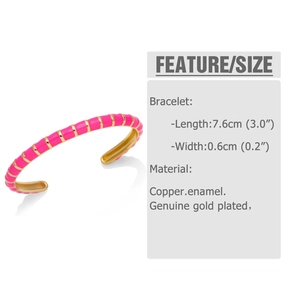 Detailed macro view of pink enamel bangle showing gold-plated brass texture and stripes