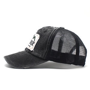 Vintage dark grey trucker hat with EXPLORER embroidery and breathable mesh panels
