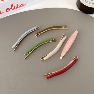 Set of six colorful acetate hair clips with gold metal base in assorted candy colors
