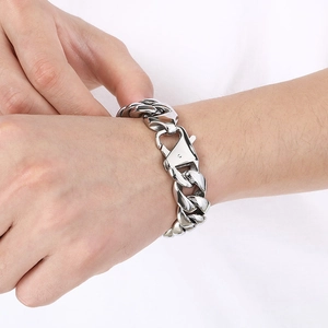 Polished stainless steel 18mm Cuban link bracelet for men with secure lobster clasp on wrist