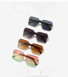 Detailed view of oversized square sunglasses in four trendy gradient colors with metal frames
