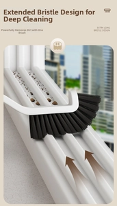 Detail of long stiff bristles on a white crevice cleaning brush for window grooves
