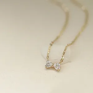 Minimalist 14k gold S925 silver necklace with mini bow-shaped heart crystal pendant