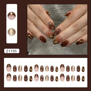 French amber cat-eye press-on nails with leopard patterns and sparkling rhinestones