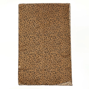 Detailed view of the leopard print pattern on a lightweight chiffon scarf fabric