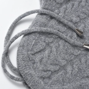 Winter cable knit beanie in dark grey featuring soft texture and metal-tipped drawstrings