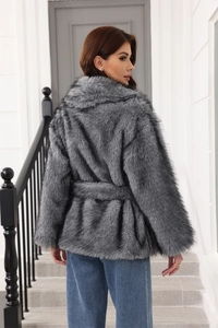 Detail of grey faux fur coat with belt showing the thick texture and back tailoring