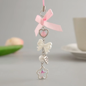 Pink ribbon bow phone charm with white beads, pearls and silver heart pendants