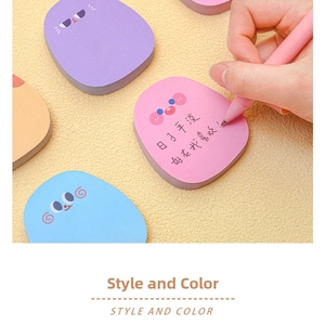 Detailed view of cute cartoon sticky notes in pastel colors with handwritten text detail