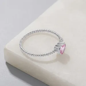 Elegant s925 sterling silver ring featuring a pink heart zircon with twist band design