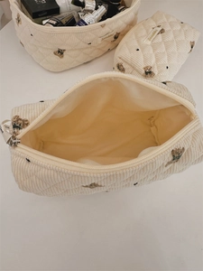 Detailed view of quilted corduroy bear pouch set with large capacity and soft texture