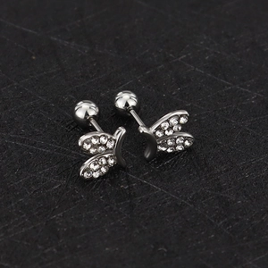 Detail view of silver butterfly stud earrings with sparkling cubic zirconia pavé and screw back