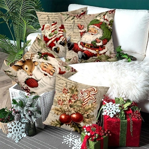 Set of 4 Christmas throw pillow covers with Santa and Reindeer on a white sofa
