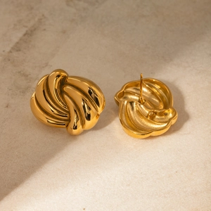 Sculptural 18k gold plated stainless steel wave stud earrings with polished finish