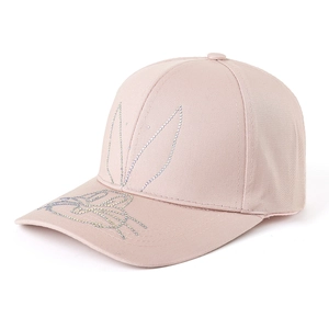 Detail view of pink baseball cap with rhinestone bunny ears and high-quality cotton texture