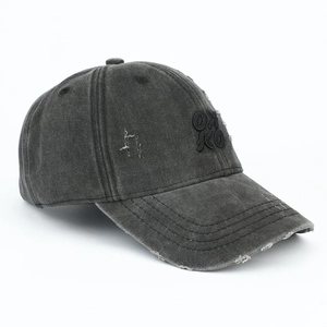 Detail view of the distressed OXKO embroidery on this vintage washed charcoal baseball cap