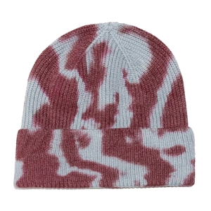 Detailed view of the ribbed knit texture and tie-dye pattern on this winter beanie
