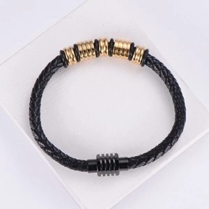 Men's braided black leather bracelet with 18k gold plated accents and magnetic buckle