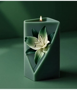 Detail of dark green geometric lily candle with exquisite 3D floral carving on the side