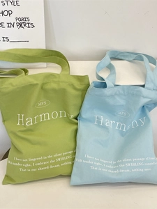 Minimalist canvas tote bags with Harmony letter print in green and light blue colors