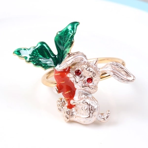 Silver bunny napkin ring with red carrot and green leaves for festive table decor