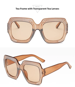 Macro detail of square oversized sunglasses with crystal pavé and tea tinted lenses