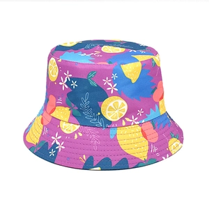Detail of purple bucket hat with lemon print showing durable canvas and stitching