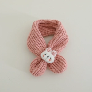 Detail of pink ribbed knit kids scarf featuring a cute plush bunny decoration