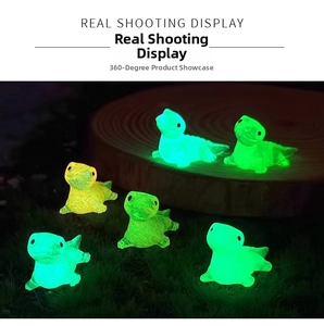 Luminous resin mini crocodile figurines glowing in the dark on garden grass