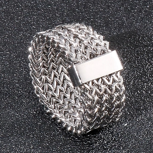 Detail of silver stainless steel ring with woven mesh band and flat rectangular plate