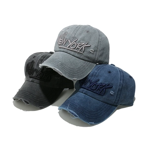 Distressed cotton baseball caps with New York embroidery in grey, black, and navy blue