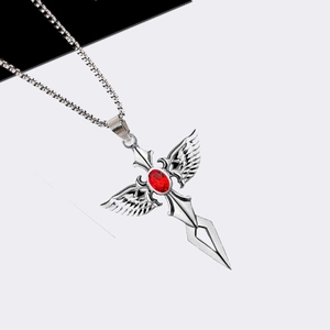 Gothic sword necklace with silver wings and red gemstone on a diagonal contrast background