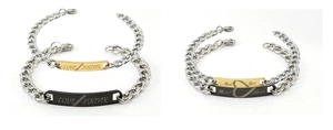 Detail of stainless steel couple bracelets with Love Forever and Real Love engravings