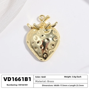 Detailed view of a brass strawberry pendant with textured surface and gold finish