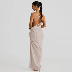Detail of elegant backless champagne maxi dress with intricate lace-up knotted straps