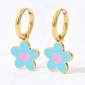 Golden flower hoop earrings with blue enamel petals and pink heart center in a sweet style