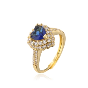Close-up of heart-shaped blue gemstone ring with 18K gold plating and pavé accents