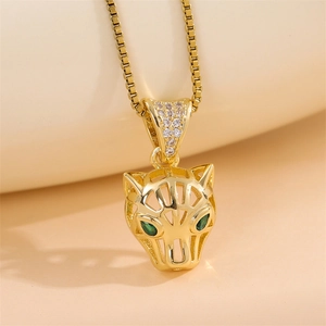 Minimalist gold hollow leopard head necklace with sparkling green zircon eyes